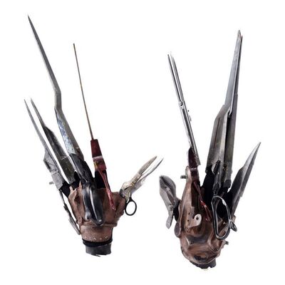 Lot #123 - Edward Scissorhands' (Johnny Depp) Scissor Hand Set with Screen-Matched Retractable Blades ### EDWARD SCISSORHANDS (1990)
