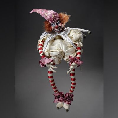 Lot #318 - Screen-Matched Evil Clown Doll ### POLTERGEIST (1982)
