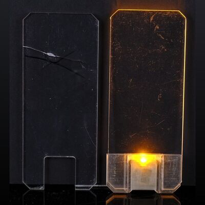 Lot # 14: Josephus Miller's (Thomas Jane) Light-up Comm and "Broken" Comm Devices