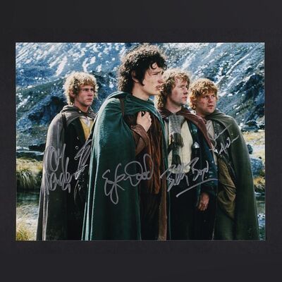 Lot #357 - THE LORD OF THE RINGS: THE FELLOWSHIP OF THE RING (2001) - Elijah Wood, Sean Astin, Billy Boyd and Dominic Monaghan Autographed Oversized Still