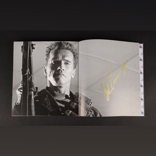 Lot #546 - THE TERMINATOR (1984) AND TERMINATOR 2: JUDGMENT DAY (1991) - Two Terminator Vault Books (English and Spanish) Autographed by Arnold Schwarzenegger, Robert Patrick and Kristanna Loken