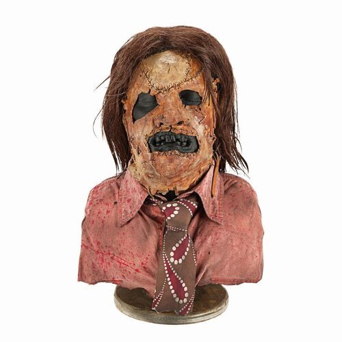 Lot #247: LEATHERFACE: THE TEXAS CHAINSAW MASSACRE III (1990) - Leatherface (R.A. Mihailoff) Mask Display