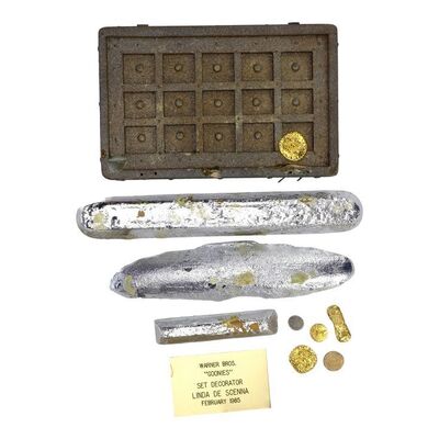 Lot #1147: THE GOONIES (1985) - Set of One-Eyed Willy's Coins and Treasure with Set Decorator Plaque