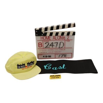 Lot #1193: HOME ALONE 2: LOST IN NEW YORK (1992) - B-Camera Clapperboard, Cast Chair Back, Crew Hat and Crew Badge