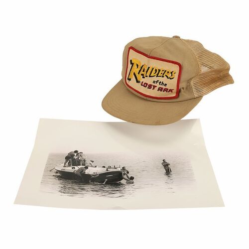 Lot #1212: RAIDERS OF THE LOST ARK (1981) - Crew Cap and Behind-the-scenes Photograph