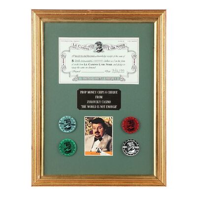 Lot #1286: JAMES BOND: THE WORLD IS NOT ENOUGH (1999) - Elektra King's (Sophie Marceau) Cheque and Zukovsky (Robbie Coltrane) Casino Chips Display
