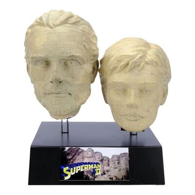 Lot #1667: SUPERMAN II (1980) - General Zod's (Terence Stamp) and Ursa's (Sarah Douglas) Mount Rushmore Head Model Miniatures on Display