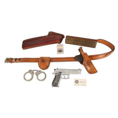 Lot #1738: WALKER, TEXAS RANGER (1993 - 2001) - Cordell Walker's (Chuck Norris) Stunt Gun, Signet Ring, Handcuffs, Gun Belt, Desk Plaque and Business Card