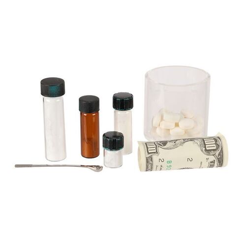 Lot #1772: THE WOLF OF WALL STREET (2013) - Jordan Belfort's (Leonardo DiCaprio) Cocaine Vials, Tablets, Rolled Money and Snuff Spoon