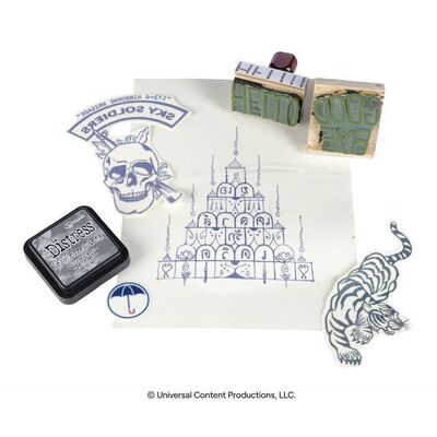 Lot # 204: The Umbrella Academy (2019-2024): Klaus Hargreeves's (Robert Sheehan) Tattoo Set with Hand Stamps
