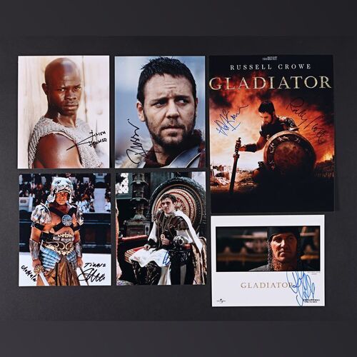 Lot #126 - GLADIATOR (2000) - Russell Crowe, Joaquin Phoenix, Ridley Scott, Hans Zimmer, Djimon Hounsou, Ralf Moeller and Sven-Ole Thorsen Autographed Mini Poster and Stills