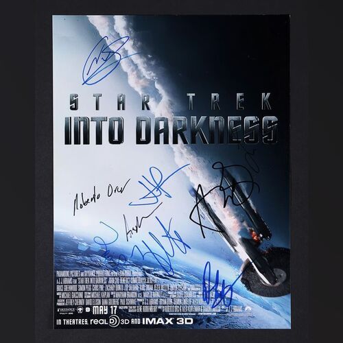 Lot #335 - STAR TREK INTO DARKNESS (2013) - J. J. Abrams, Zoe Saldana, Simon Pegg, Zachary Quinto, Noel Clarke, Damon Lindelof and Others Signed Mini Poster