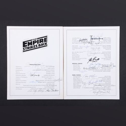 Lot #346 - STAR WARS: THE EMPIRE STRIKES BACK (1980) - Exhibitor's Cast and Crew Booklet Autographed by George Lucas, Irvin Kershner, Mark Hamill, Harrison Ford, Carrie Fisher, Alec Guinness and Others, 1980