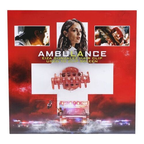 Lot #1117 - Framed Bloodied Cam Thompson (Eiza Gonzalez) Hair Clip ### AMBULANCE (2022)