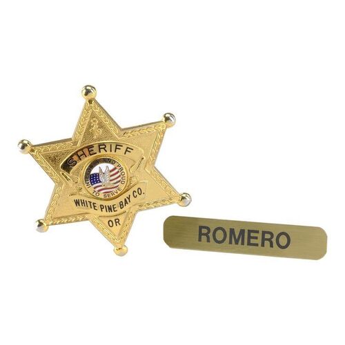 Lot #1141 - Sheriff Alex Romero's (Nestor Carbonell) White Pine Bay Badge and Name Tag ### BATES MOTEL (T.V. SERIES, 2013 - 2017)