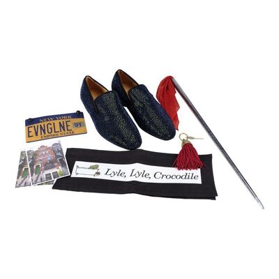 Lot #1386 - Hector P. Valenti's (Javier Bardem) Magic Cane, Key, Chairback, License Plate and Blue Shoes ### LYLE, LYLE, CROCODILE (2022)