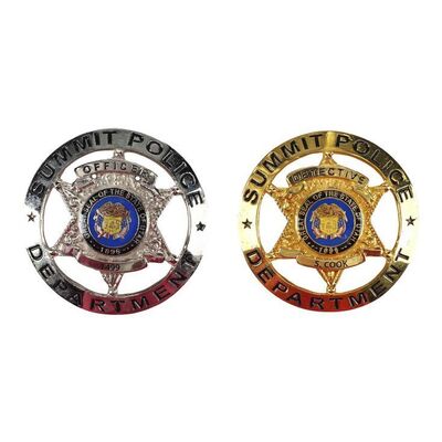Lot #1432 - Pair of Badges ### MOSAIC (T.V. SERIES, 2018)