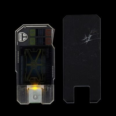 Lot # 330: The Expanse (2015-2022): Tycho Station Belter Light-up Comm Device and Broken Screen Belter Comm Device