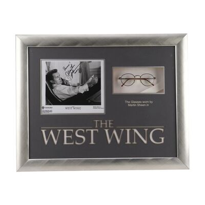1898. President Josiah "Jed" Bartlett's Framed Glasses with Martin Sheen-Autographed Promotional Still ### THE WEST WING (1999-2006)