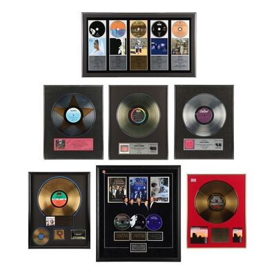 506. Nordoff and Robbins Collection: Seven Assorted Artists Disc Awards ### DAVID MUNNS