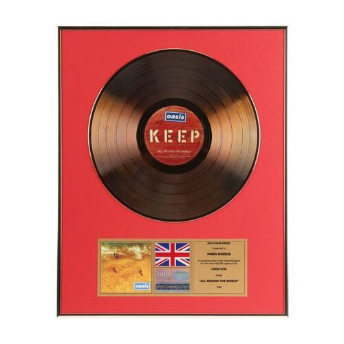 658. "All Around The World" Gold Disc Presented to Owen Morris ### OASIS
