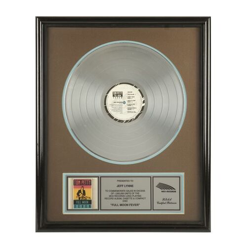 809. "Full Moon Fever" Platinum Disc Presented to Jeff Lynne ### TOM PETTY