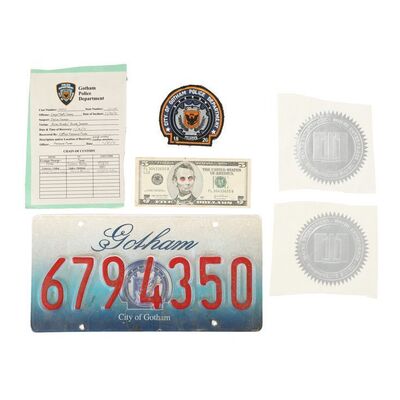 924. Police Badge and Evidence Ticket, Wayne Enterprises Labels, Gotham Number Plate and Promotional Bill ### THE DARK KNIGHT (2008)