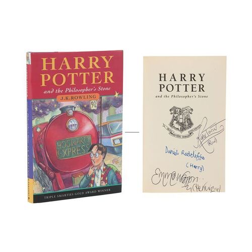 1205. Daniel Radcliffe and Cast-Autographed Book ### HARRY POTTER AND THE PHILOSOPHER'S STONE (2001)