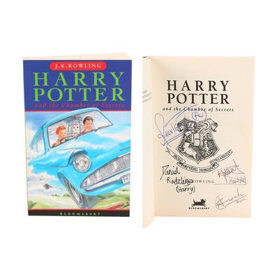 1215. Daniel Radcliffe and Cast-Autographed Paperback Book ### HARRY POTTER AND THE CHAMBER OF SECRETS (2002)
