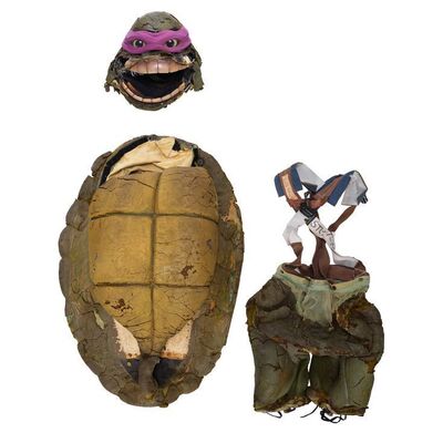 1254. Planet Hollywood Collection: Set of Turtle Stunt Costume Components ### TEENAGE MUTANT NINJA TURTLES (1990)/TEENAGE MUTANT NINJA TURTLES II: SECRET OF THE OOZE (1991)