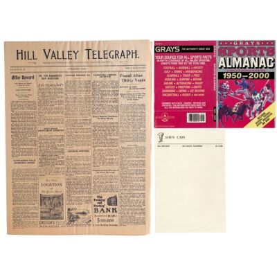 13. Lou's Cafe Letterhead with Production-Made Grays Sports Almanac Cover and Hill Valley Telegraph Newspaper ### BACK TO THE FUTURE TRILOGY (1985-1990)