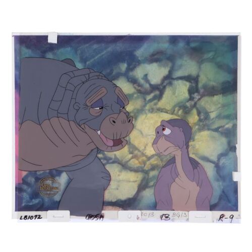 366. Littlefoot and Rooter Key Production Cel and Background Setup ### THE LAND BEFORE TIME (1988)