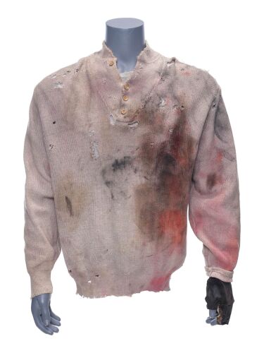 564. Gabe Walker's (Sylvester Stallone) Sweater, Shirt, and Gloves ### CLIFFHANGER (1993)