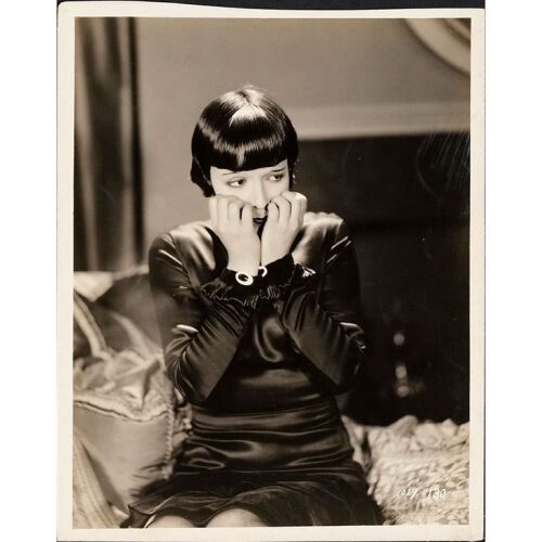 825. Vintage Original B&W Silver Gelatin Single-Weight Glossy Keybook Photograph (8" x 10") Signed by Louise Brooks (Louise's handwriting on back) (Beckett COA); Fine+ on Linen ### LOVE 'EM AND LEAVE 'EM (1926)