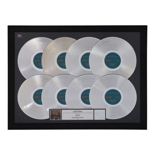 457. Definitely Maybe Eight Platinum Disc Award Presented to Owen Morris ### OASIS