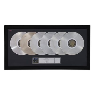 503. Be Here Now Six Platinum Disc Award Presented to Owen Morris ### OASIS