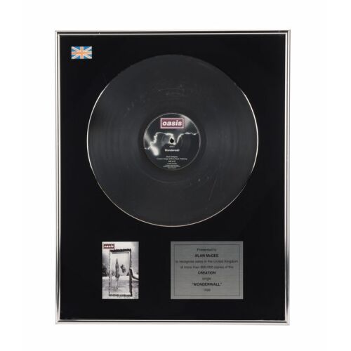 563. Wonderwall Platinum Disc Award Presented to Alan McGee ### OASIS