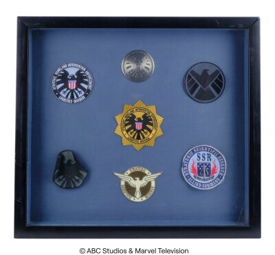 Lot #12: Framed Set of Seven S.H.I.E.L.D. Patches ### MARVEL'S AGENTS OF S.H.I.E.L.D. (2013-2020)