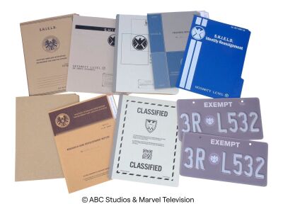 Lot #135: Set of Eight S.H.I.E.L.D. File Folders and Two License Plates ### MARVEL'S AGENTS OF S.H.I.E.L.D. (2013-2020)