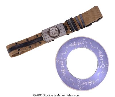Lot #262: Deke Shaw's Stunt Gravitonium Belt with Enoch's Chronicom Interplanetary Conveyance Disc ### MARVEL'S AGENTS OF S.H.I.E.L.D. (2013-2020)