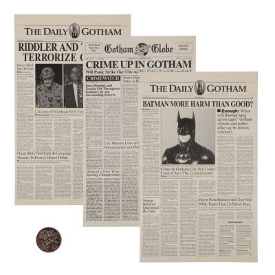 68. Two-Face's (Tommy Lee Jones) Dirtied Coin and Set of Three Gotham Newspapers ### BATMAN FOREVER (1995)/BATMAN & ROBIN (1997)