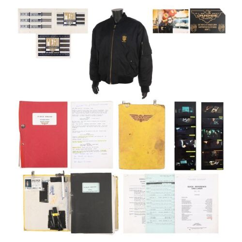 788. Pair of Bound Annotated Revised Scripts, Production Binder, Crew Jacket, Photographs, and Assorted Ephemera ### JUDGE DREDD (1995)