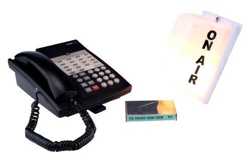 128. Dr. Frasier Crane's (Kelsey Grammer) Light-Up KACL "ON AIR" Studio Light, Broadcast Booth Phone, and "The Frasier Crane Show" Cassette Case ### FRASIER (T.V. SERIES, 1993 - 2004)