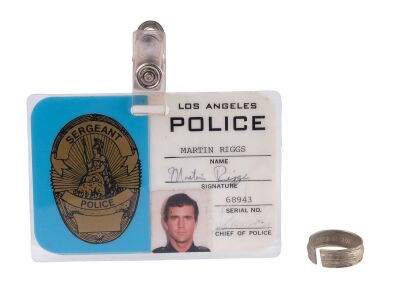 251. Mike Papac Collection: Martin Riggs' (Mel Gibson) Wedding Ring and Production-Made LAPD ID ### LETHAL WEAPON (1987)