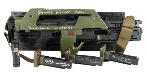 452. Sigourney Weaver-Autographed Light-Up Hollywood Collectibles Group Pulse Rifle and Carrie Henn-Autographed Light-Up SD Studios "Locator Tube" Replicas with Set of Cast-Autographed Magazines ### ALIENS (1986)