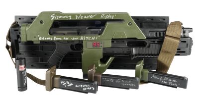 452. Sigourney Weaver-Autographed Light-Up Hollywood Collectibles Group Pulse Rifle and Carrie Henn-Autographed Light-Up SD Studios "Locator Tube" Replicas with Set of Cast-Autographed Magazines ### ALIENS (1986)