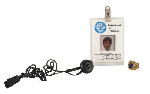 674. Mike Papac Collection: David Grant's (Kurt Russel) Paratrooper Ring, Department of Defense Badge, and Headset Microphone ### EXECUTIVE DECISION (1996)