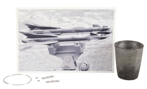 900. Tony Stark's (Robert Downey Jr.) Iron Man Mark I Suit Crucible, Palladium Microchips, and Ring with Stark Industries Missile Photograph ### IRON MAN (2008)