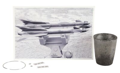 900. Tony Stark's (Robert Downey Jr.) Iron Man Mark I Suit Crucible, Palladium Microchips, and Ring with Stark Industries Missile Photograph ### IRON MAN (2008)