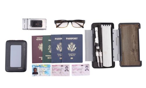 1063. Tobin Frost's (Denzel Washington) Glasses and Travel Documents with Matt Weston's (Ryan Reynolds) Driver's License and Passport, and Injector Gun ### SAFE HOUSE (2012)